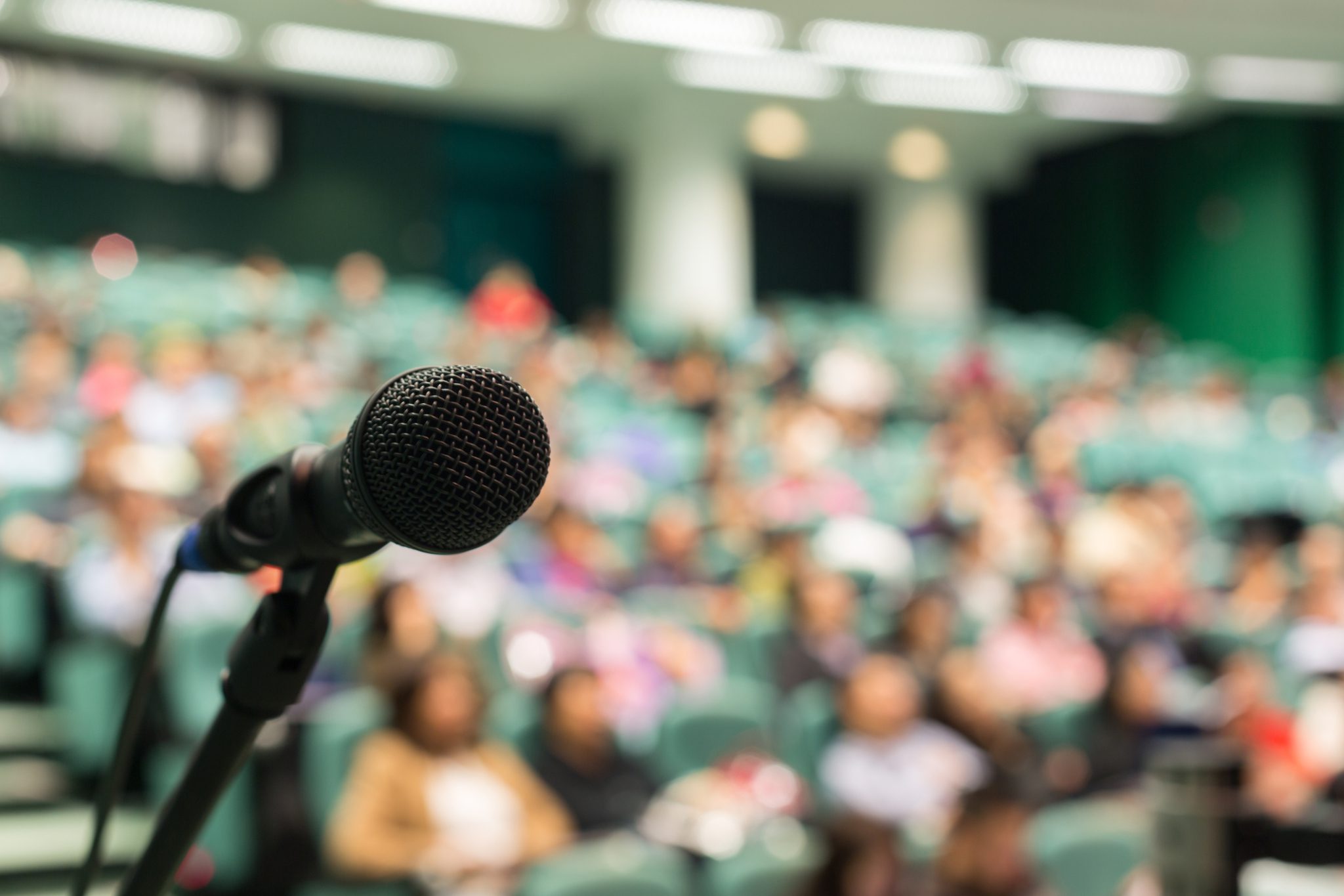 Picture of a microphone and crowd. This page contains information about event grants.